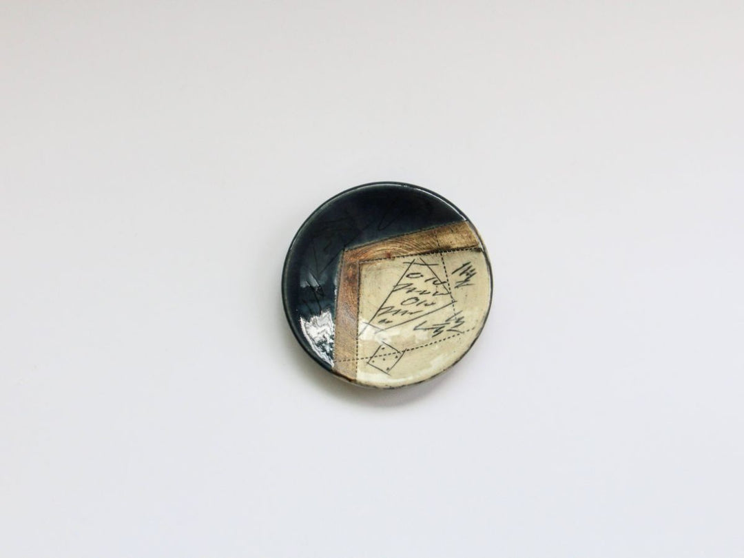 Kakurin Kiln indigo blue salt plate on a plain surface