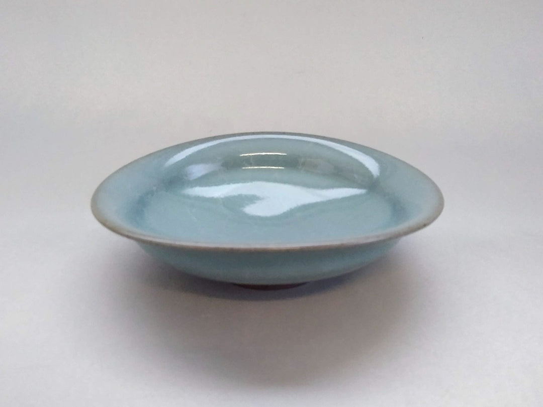 Blue and white glazed bowl-shaped pot with a white slip finish, from Fukuoka, Japan