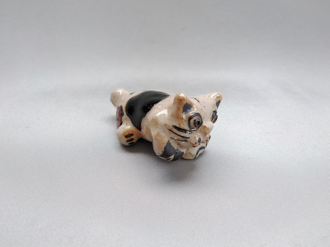 Small cat animal lying face down - Crafted By Hiroshi Sato