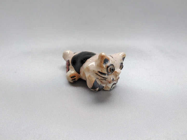 Small cat animal lying face down - Crafted By Hiroshi Sato