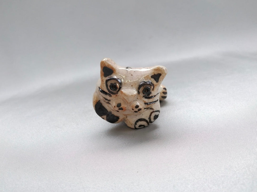 Small cat animal lying face down - Crafted By Hiroshi Sato