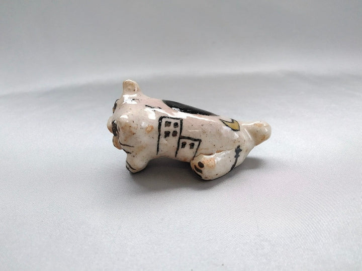 Small cat animal lying face down - Crafted By Hiroshi Sato