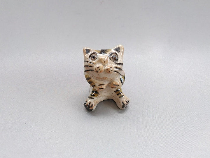 Small cat sitting - Crafted By Hiroshi Sato