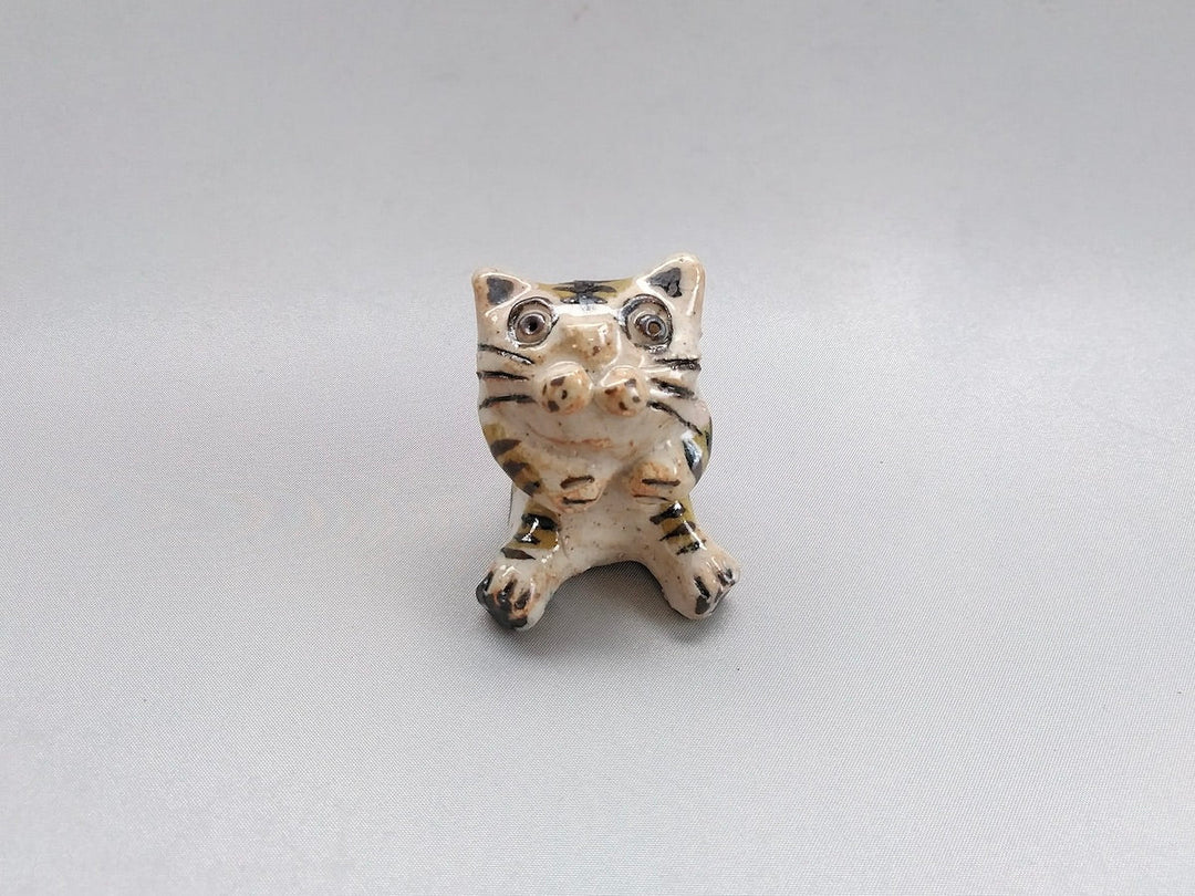 Small cat sitting - Crafted By Hiroshi Sato