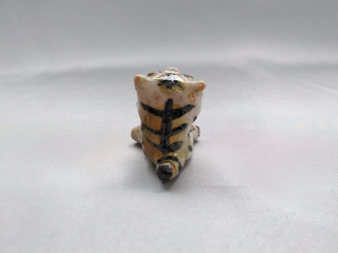 Small cat sitting - Crafted By Hiroshi Sato