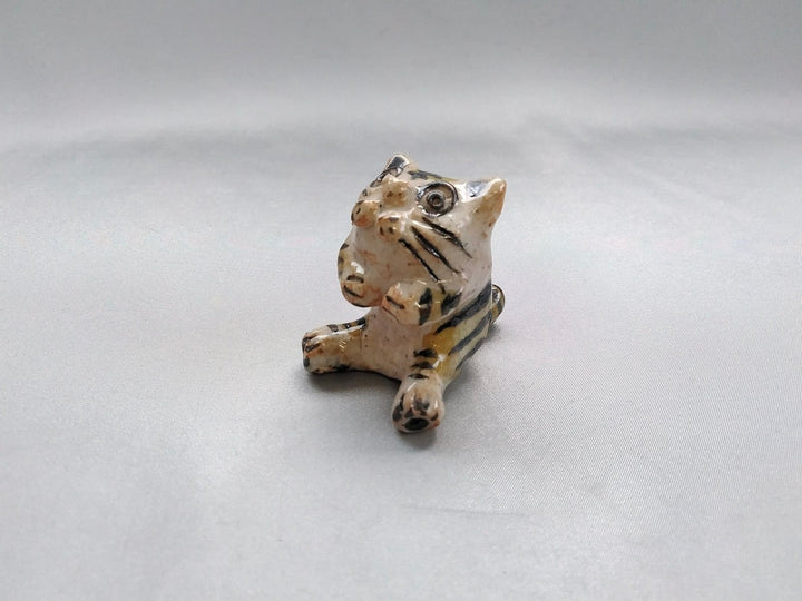 Small cat sitting - Crafted By Hiroshi Sato