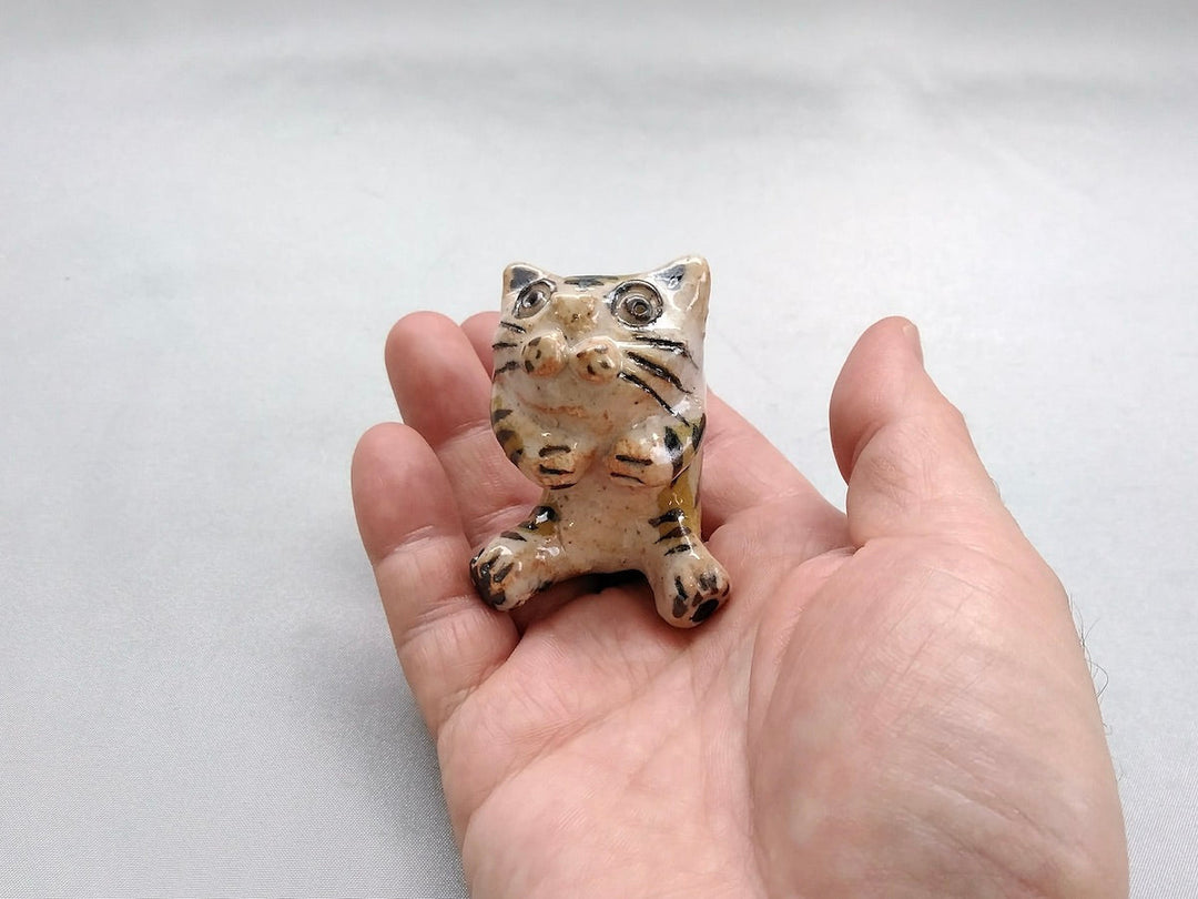 Small cat sitting - Crafted By Hiroshi Sato